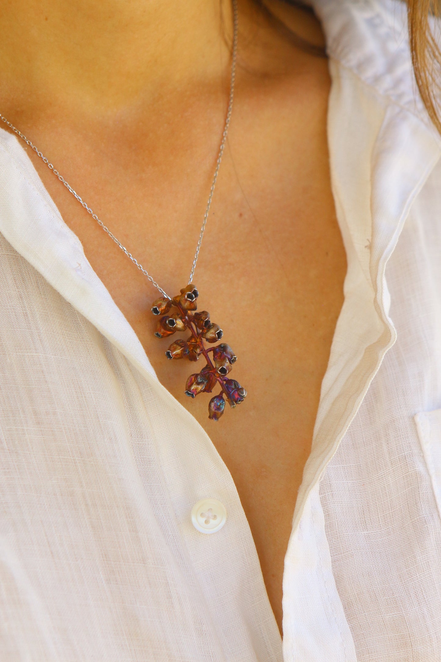 Pendente com flor de andromeda