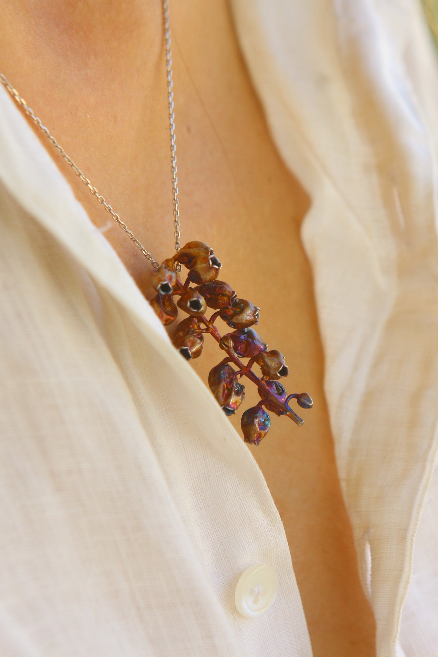 Pendente com flor de andromeda