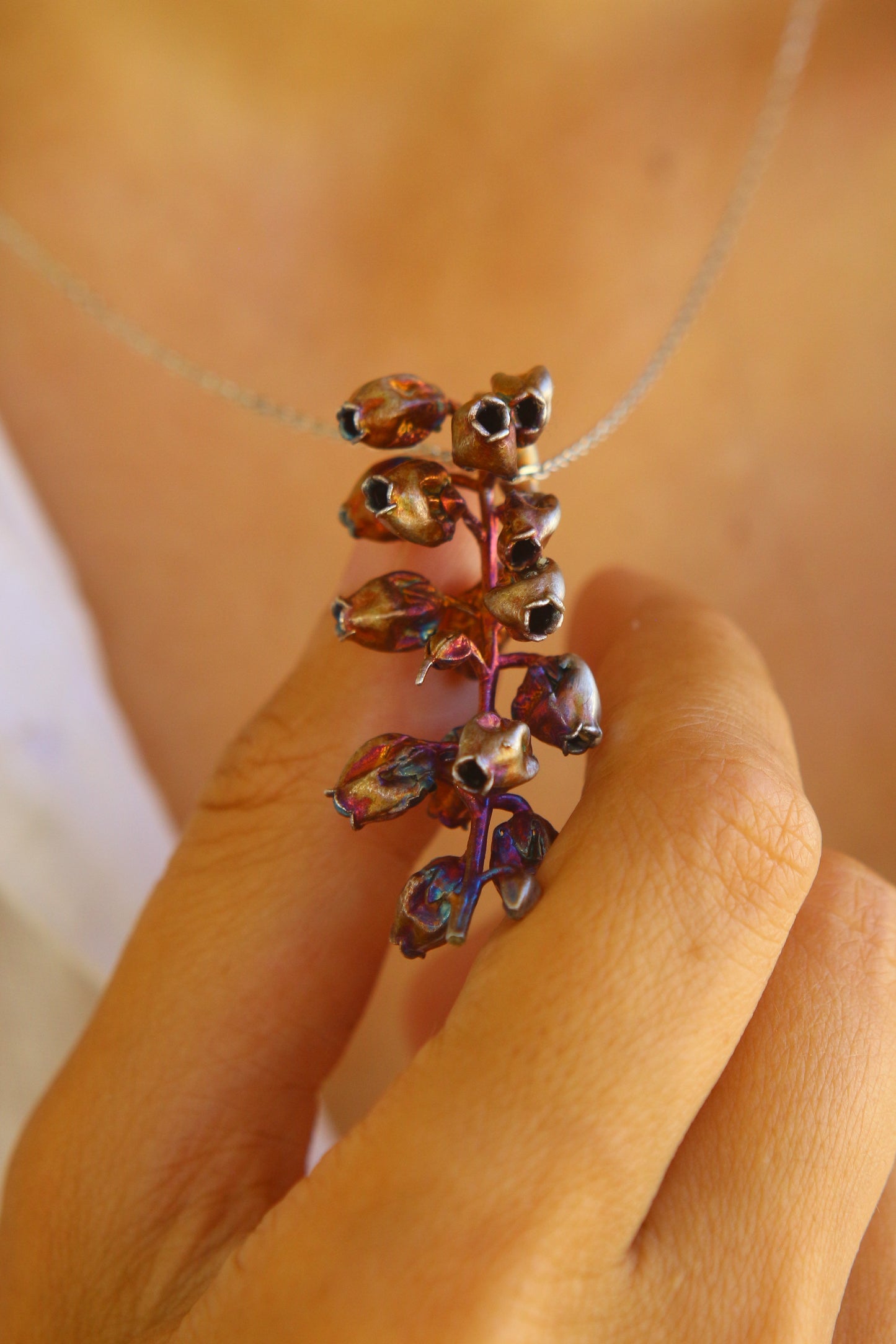 Pendente com flor de andromeda